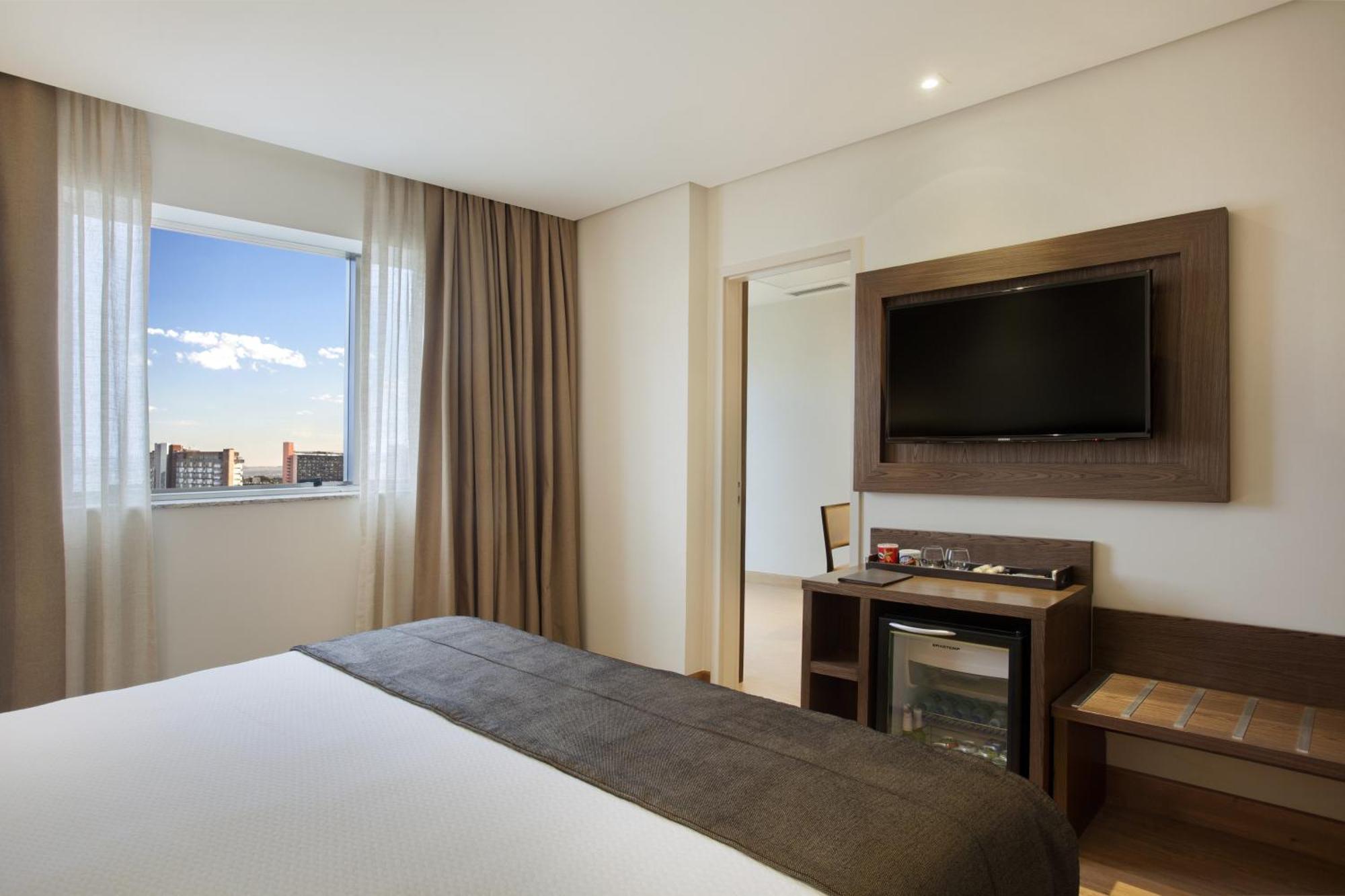 Quarto Executivo Superior com Vista da Cidade