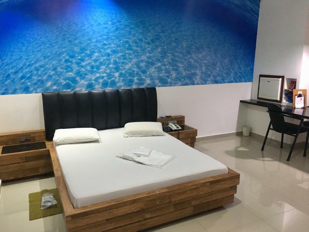 Quarto Deluxe (2 Adultos + 1 Criança)